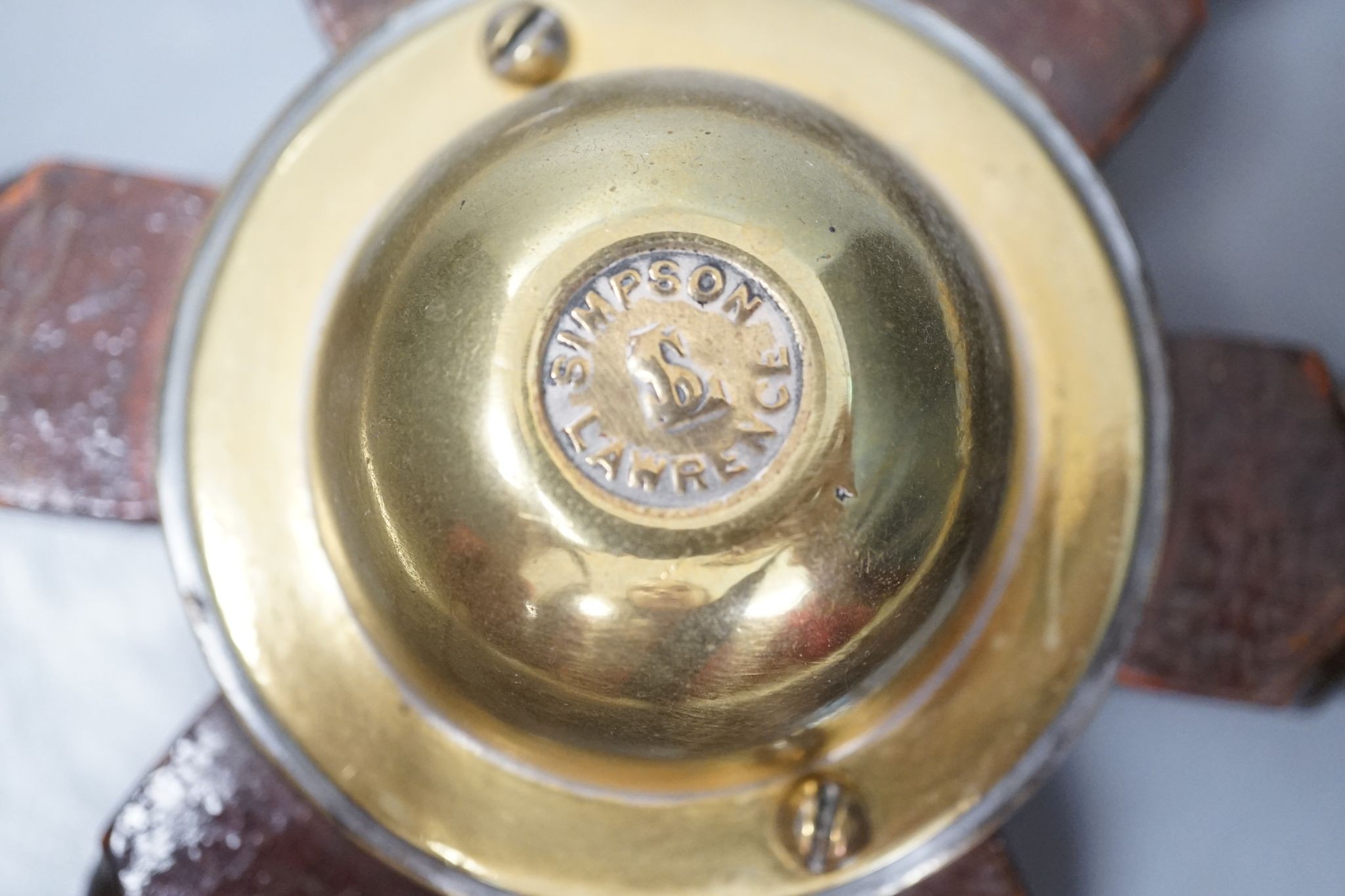 A hardwood and brass mounted Ship's wheel, signed Lawrence Simpson 50cm